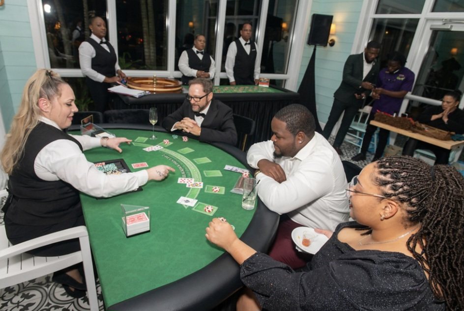 Top Tier Butlers dealer running a blackjack table at an evening event